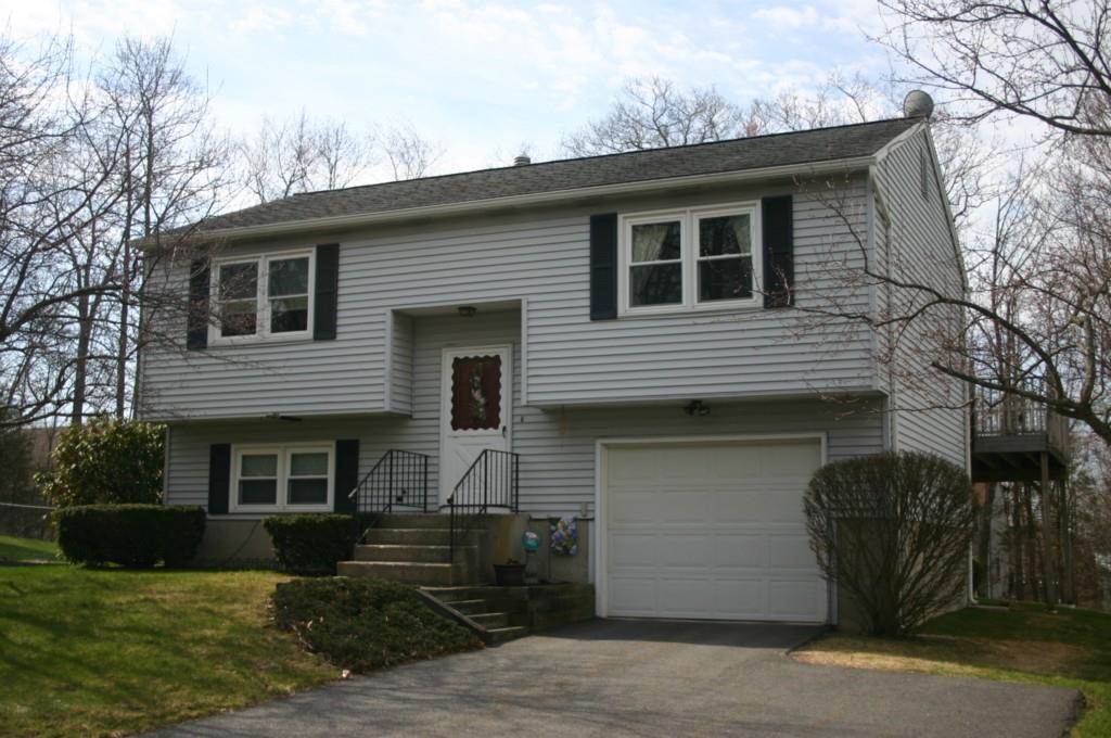 168 Concord Road Torrington, CT 06790 - Photo 1 of 1 a front view of a house with garden