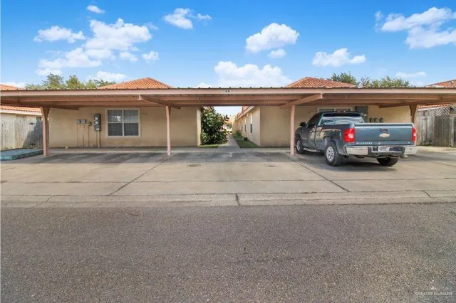 a view of a car parked in front of a house