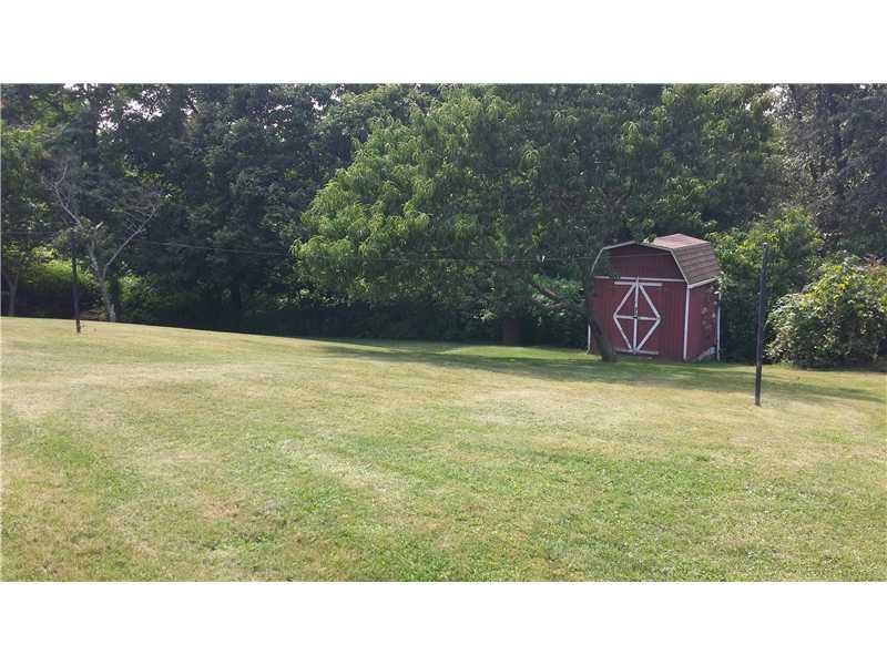 2545 Ridge Rd Extension Economy, PA 15005 - Photo 16 of 22 Yard/Garden. This backyard shot is taken from the right of the home. Relatively flat and open. A large portion of wooded area is included with the property.