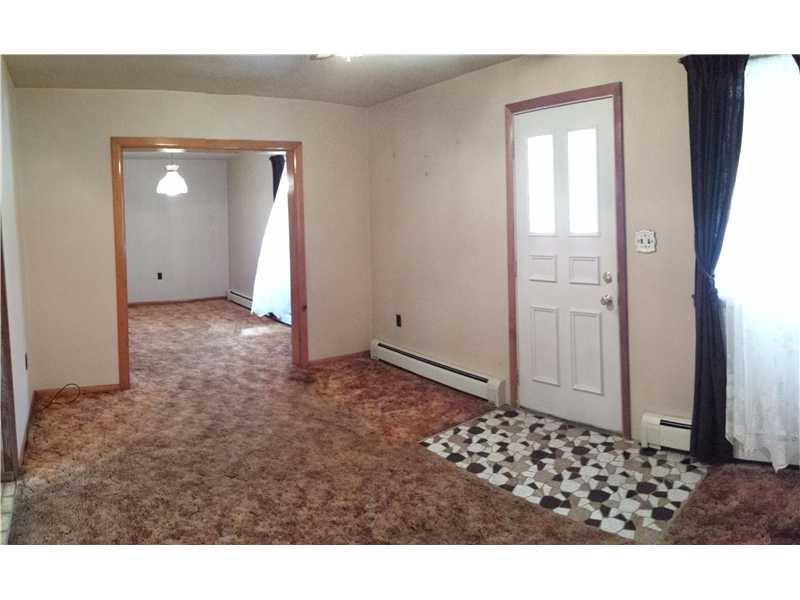 2545 Ridge Rd Extension Economy, PA 15005 - Photo 2 of 22 Living Room. The living room measures approximately 14x10. The doorway in the rear leads to the dining room.