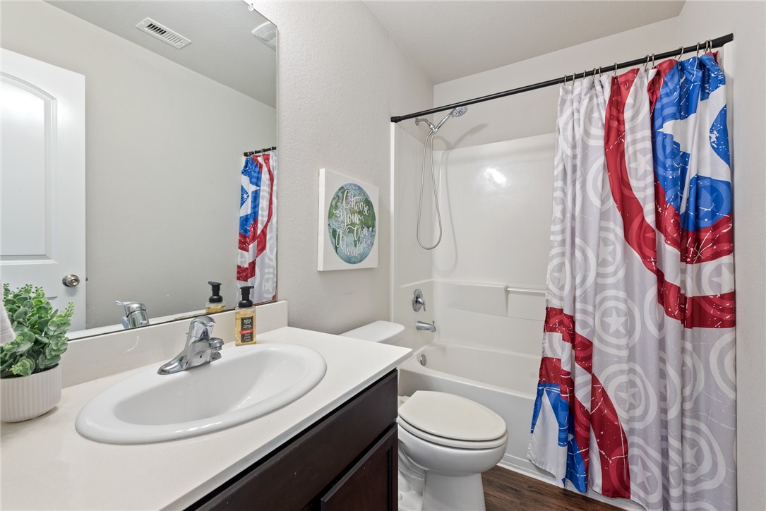2018 Eagle View Drive Navasota, TX 77868 - Photo 21 of 28 a bathroom with a sink and a mirror