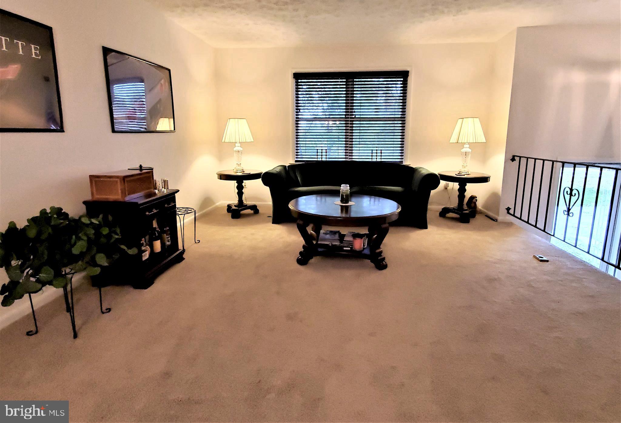 1212 Keithmont Road Catonsville, MD 21228 - Photo 3 of 33 a living room with furniture and a window