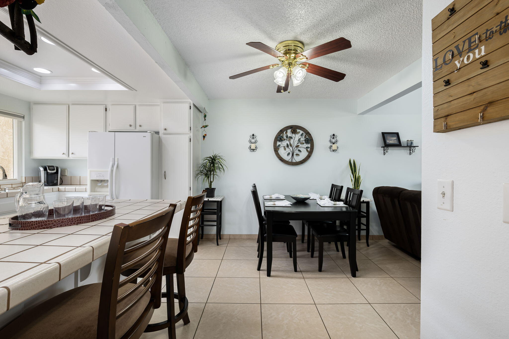 49101 Taylor Street Indio, CA 92201 - Photo 17 of 47 a view of a dining room with furniture and a chandelier