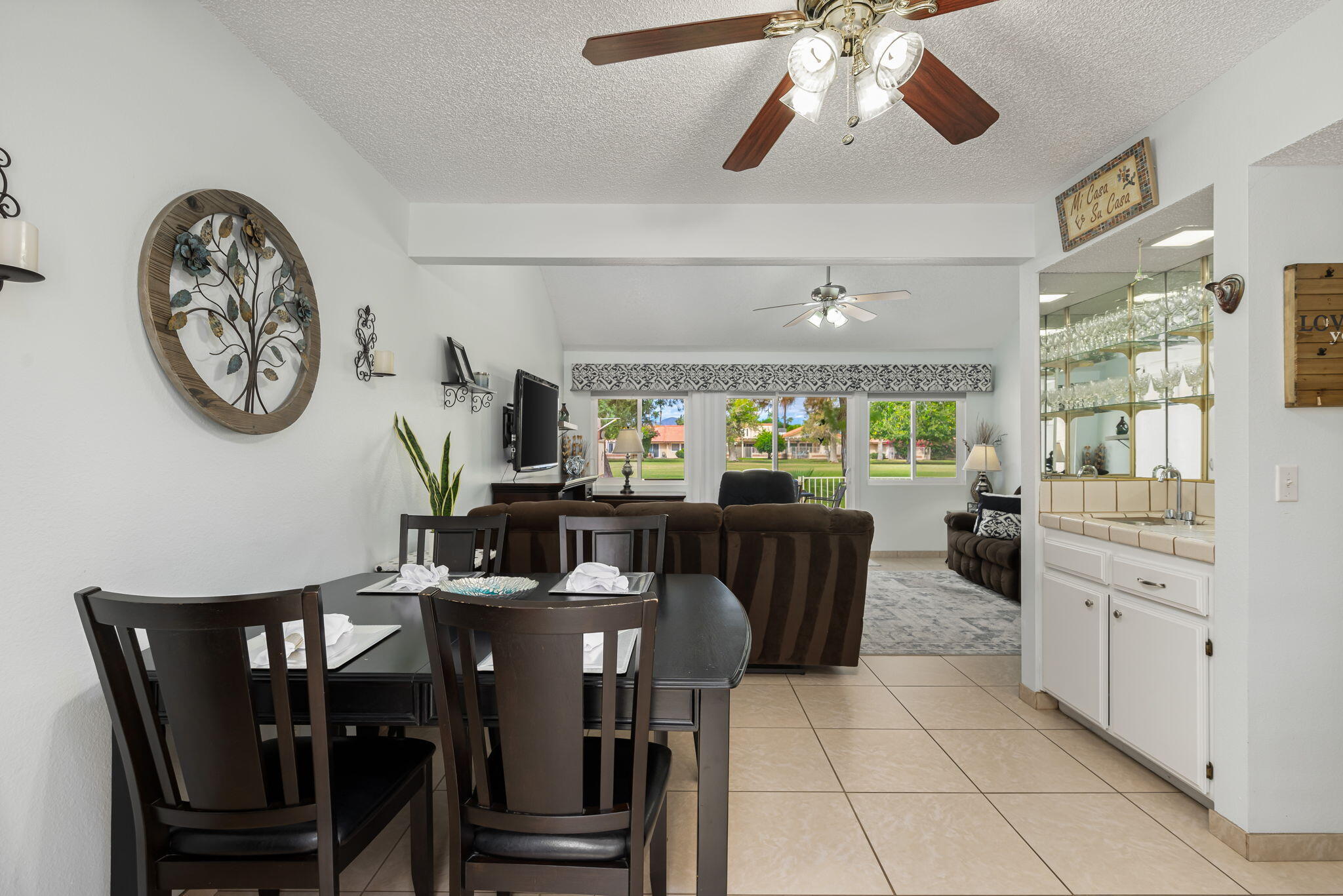 49101 Taylor Street Indio, CA 92201 - Photo 19 of 47 a view of a dining room with furniture window and outside view