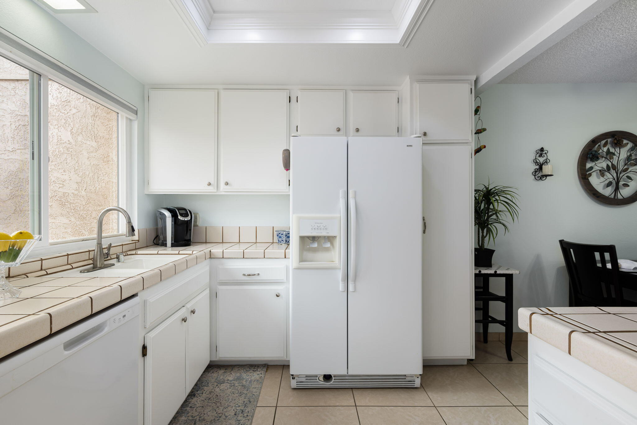 49101 Taylor Street Indio, CA 92201 - Photo 25 of 47 a kitchen with a refrigerator and a sink