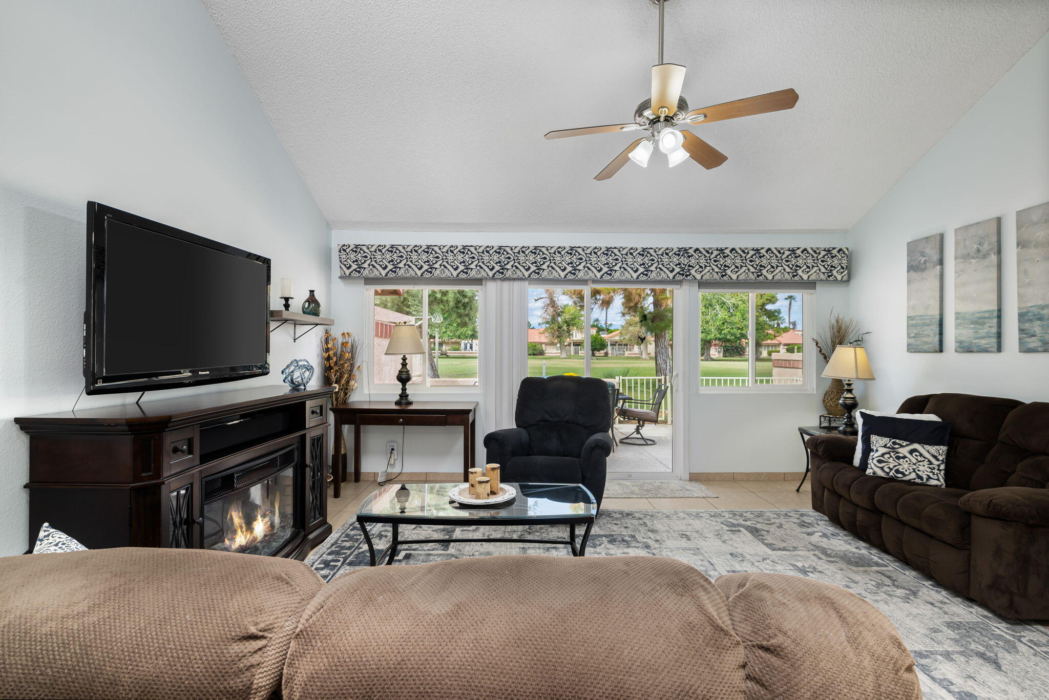 49101 Taylor Street Indio, CA 92201 - Photo 29 of 47 a living room with furniture and a flat screen tv