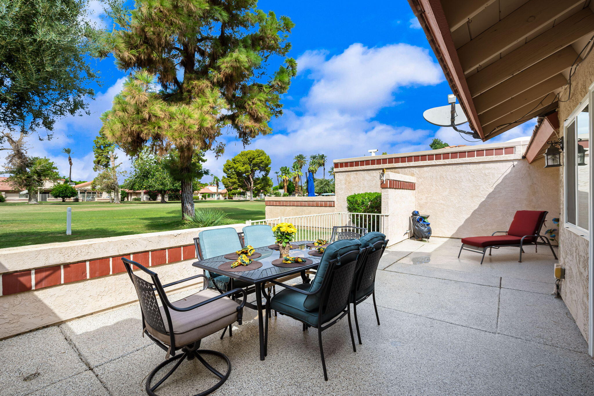 49101 Taylor Street Indio, CA 92201 - Photo 34 of 47 a view of a patio with a table and chairs