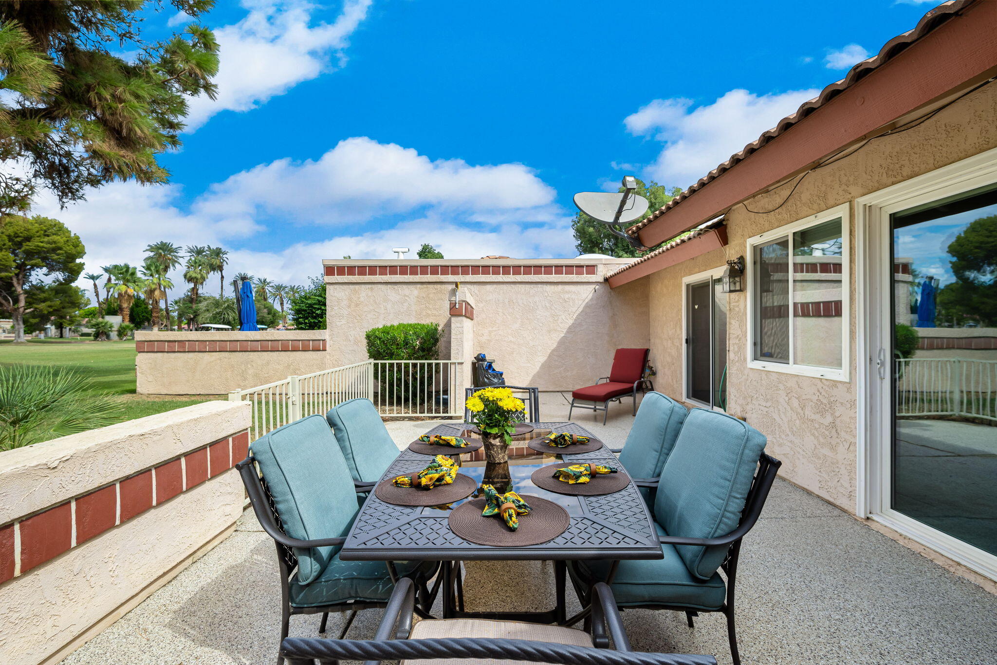 49101 Taylor Street Indio, CA 92201 - Photo 35 of 47 a view of an outdoor dining space with furniture and garden