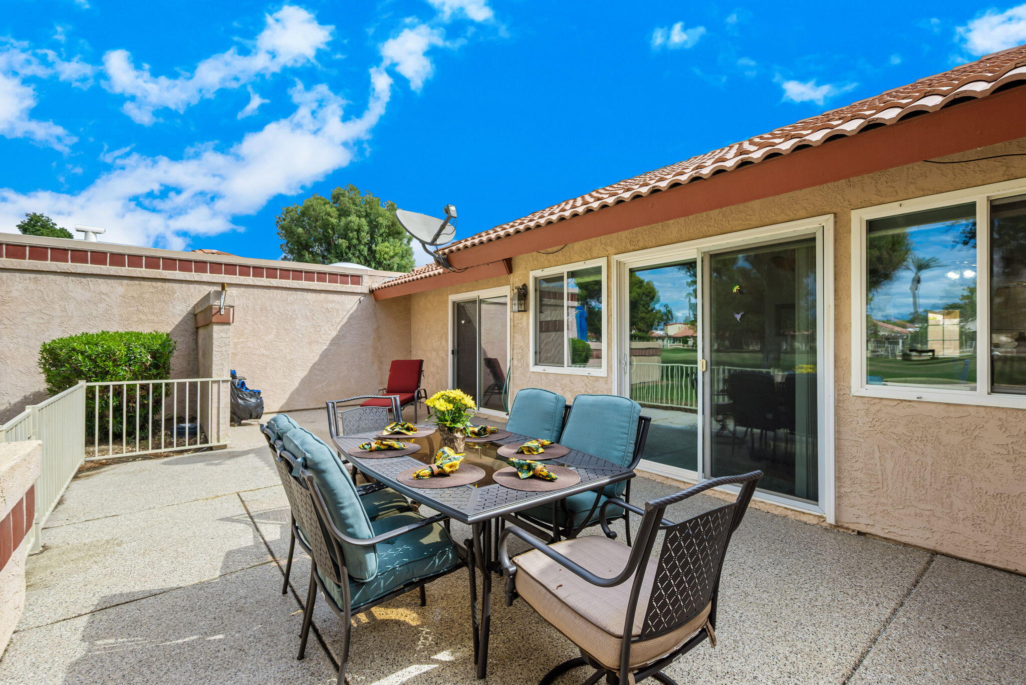 49101 Taylor Street Indio, CA 92201 - Photo 36 of 47 a view of a patio with a table and chairs