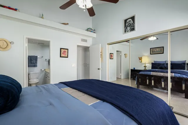 a bedroom with a bed and a table in it