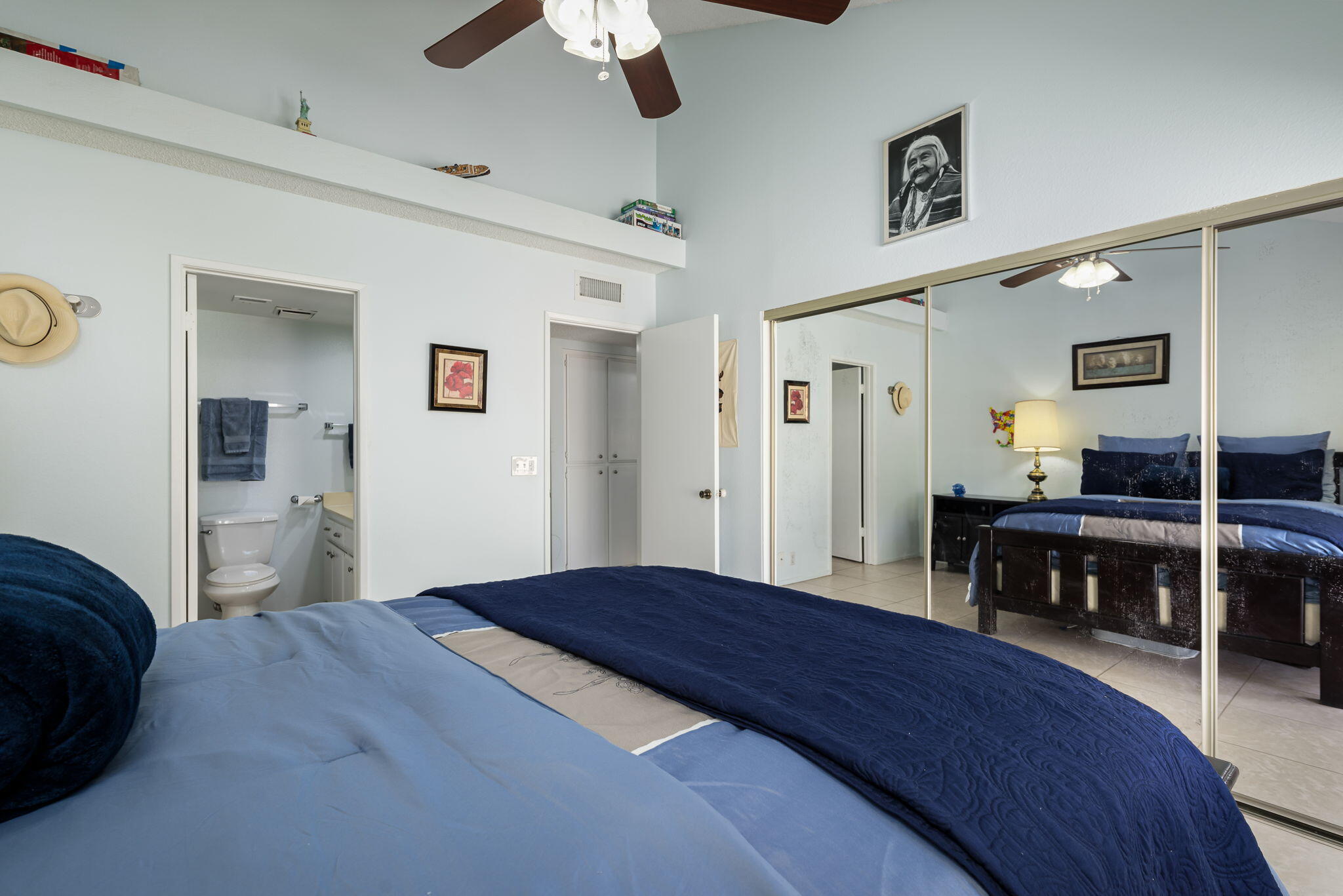 49101 Taylor Street Indio, CA 92201 - Photo 41 of 47 a bedroom with a bed and a table in it