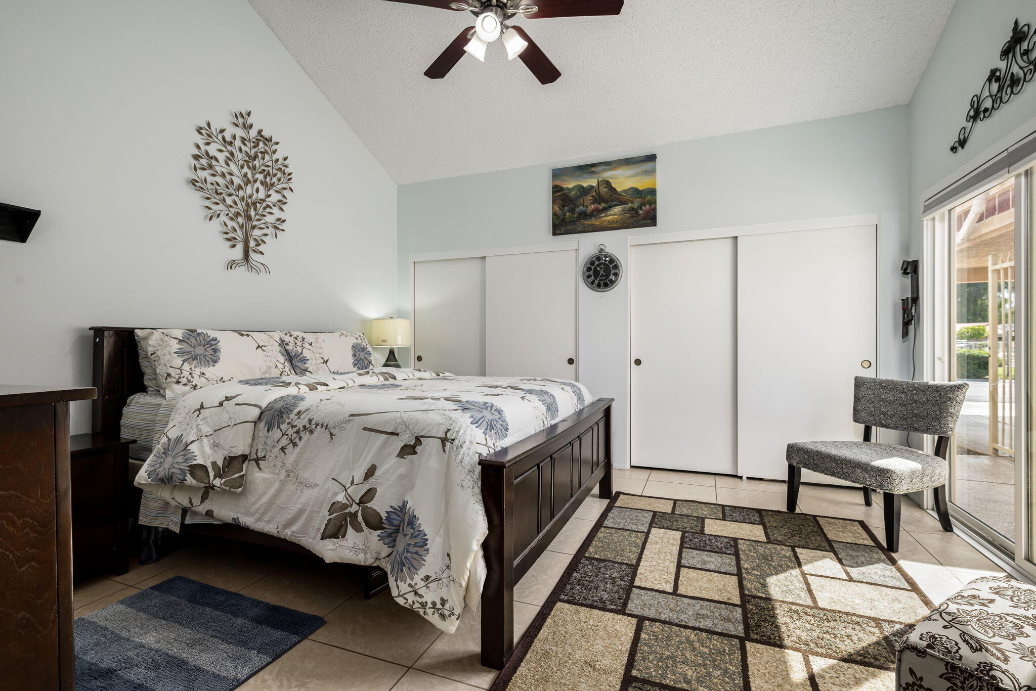 49101 Taylor Street Indio, CA 92201 - Photo 45 of 47 a bedroom with a bed and a chandelier