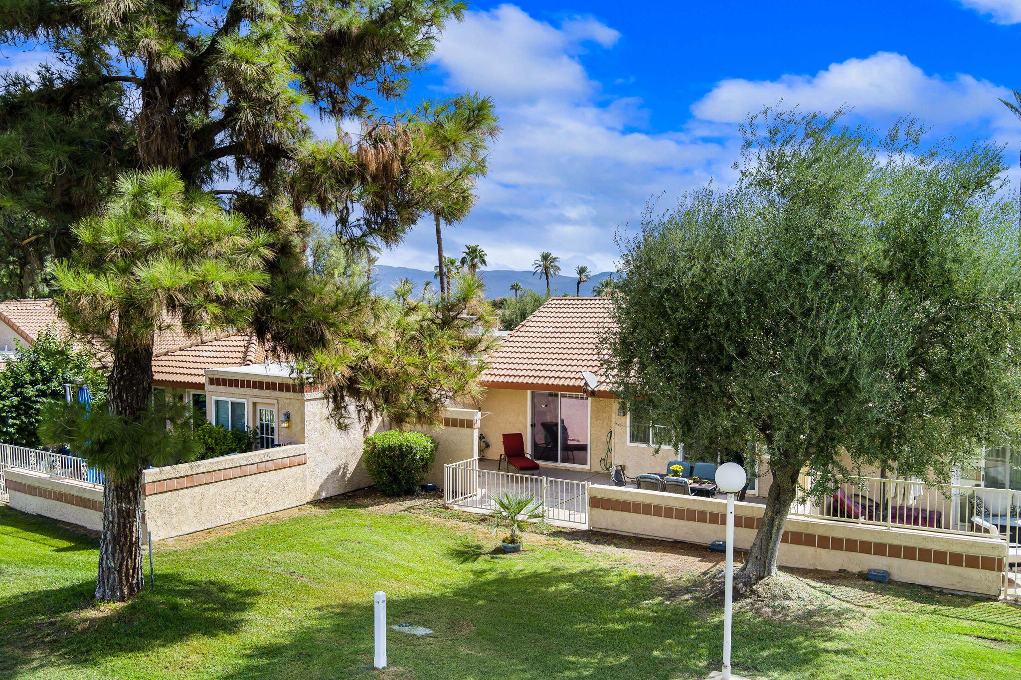 49101 Taylor Street Indio, CA 92201 - Photo 5 of 47 a swimming pool with outdoor seating and yard