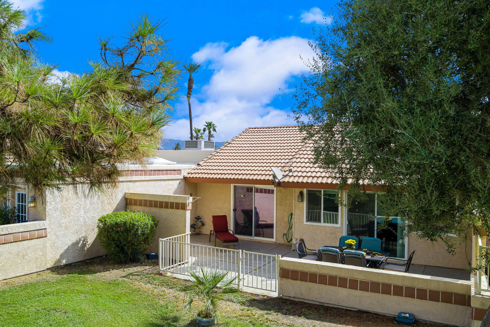 49101 Taylor Street Indio, CA 92201 - Photo 6 of 47 a view of a house with backyard and sitting area