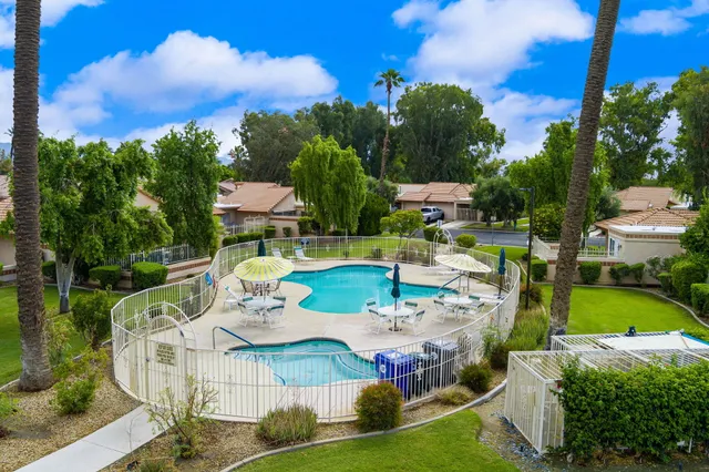 a view of a swimming pool with a patio