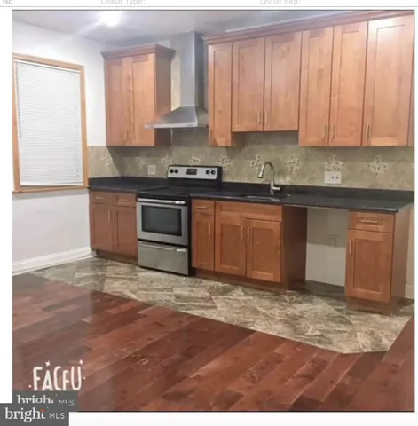 a view of a hallway with washer and dryer