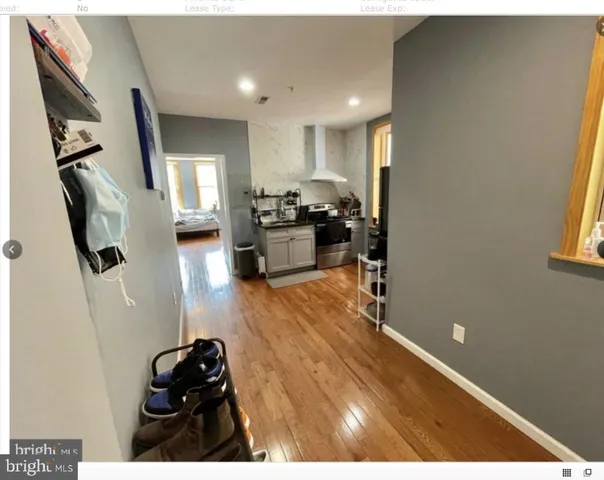 a bedroom with furniture and a flat screen tv