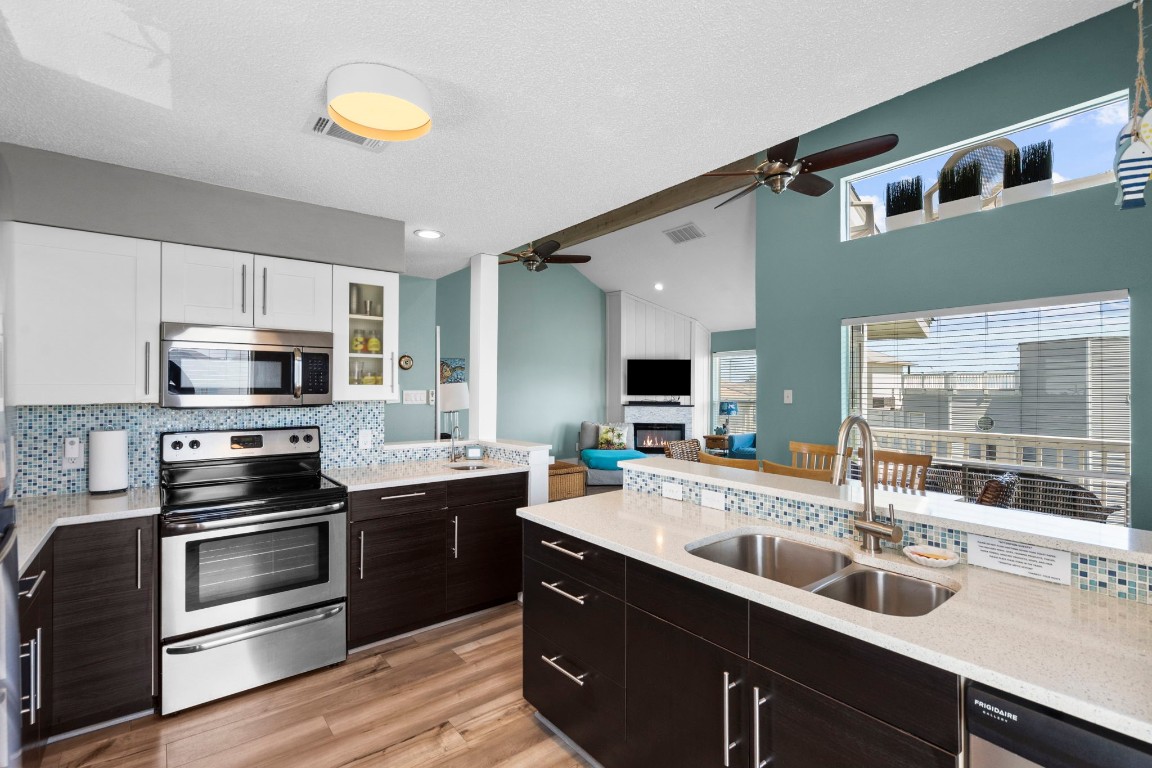 17729 Termini-San Luis Pass Road Galveston, TX 77554 - Photo 11 of 36 a kitchen with a sink and stainless steel appliances