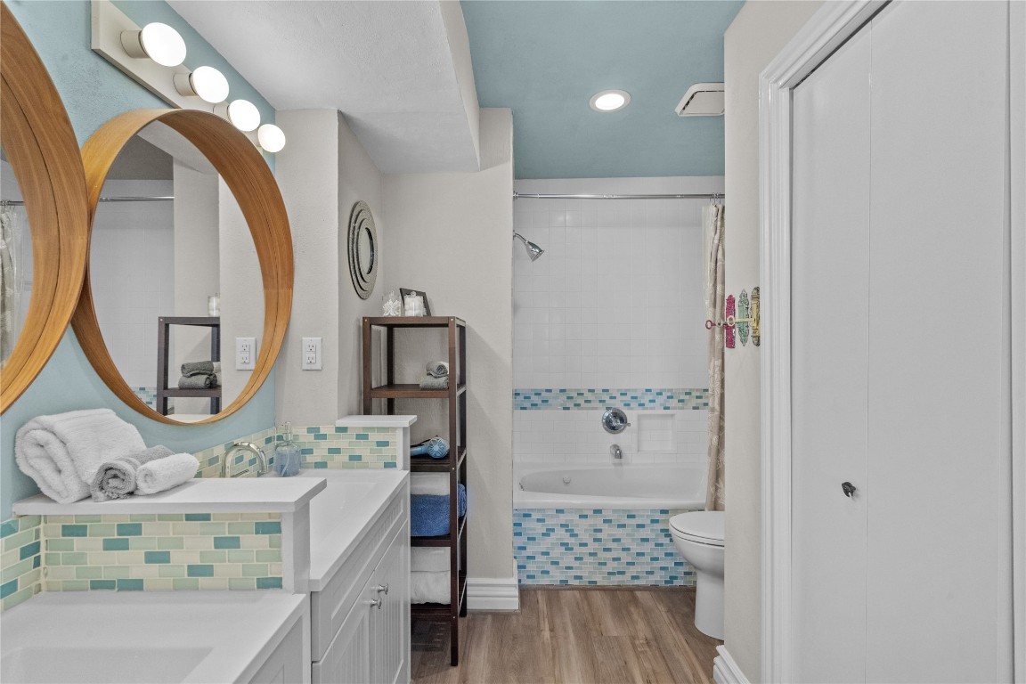 17729 Termini-San Luis Pass Road Galveston, TX 77554 - Photo 21 of 36 a bathroom with a sink a mirror a vanity and a shower