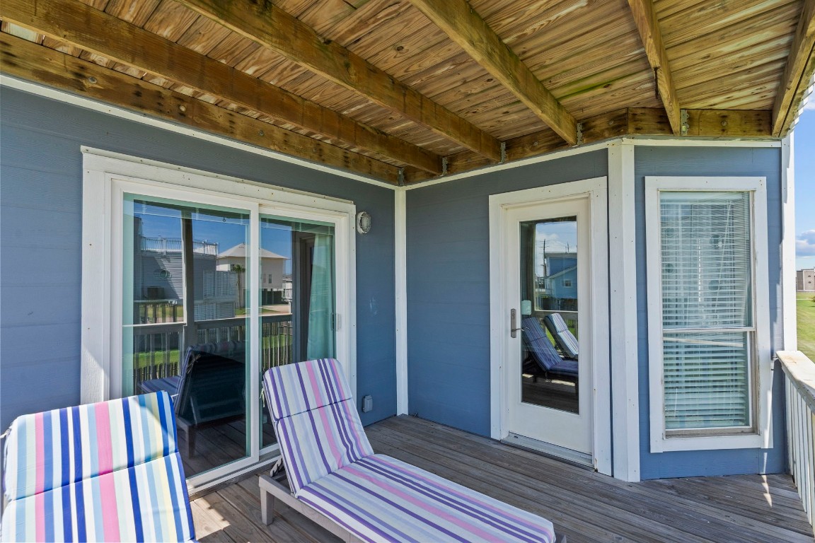 17729 Termini-San Luis Pass Road Galveston, TX 77554 - Photo 22 of 36 a view of porch with a chair and a potted plant