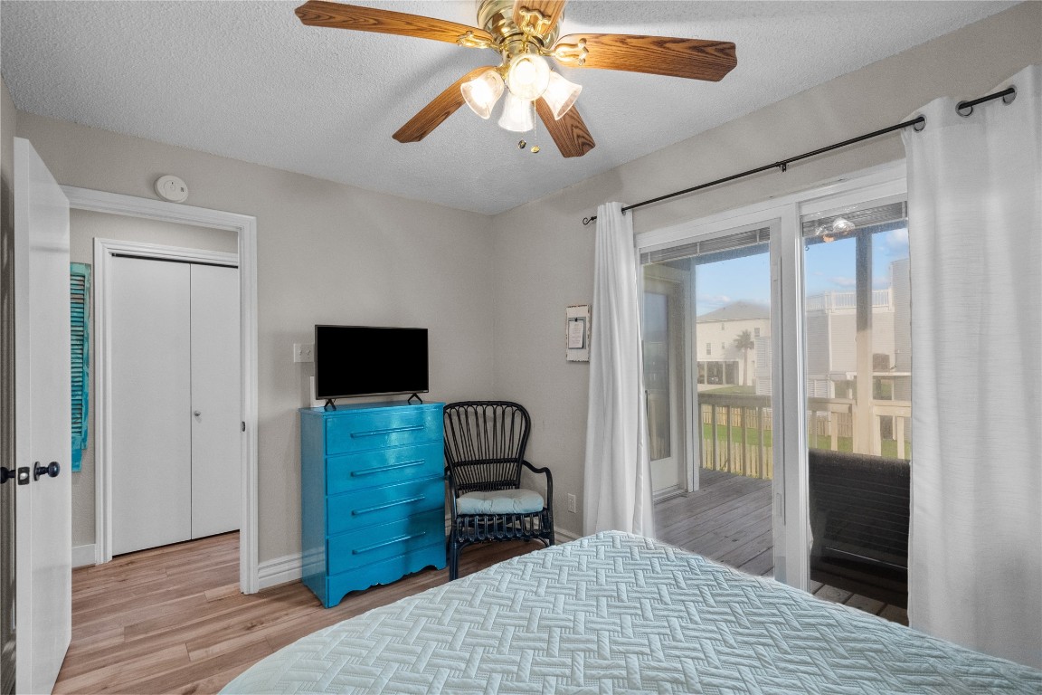 17729 Termini-San Luis Pass Road Galveston, TX 77554 - Photo 24 of 36 a bedroom with a bed and a flat tv screen