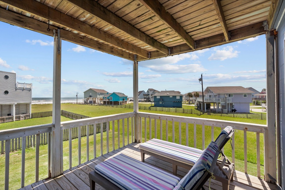 17729 Termini-San Luis Pass Road Galveston, TX 77554 - Photo 25 of 36 a view of a balcony with wooden floor