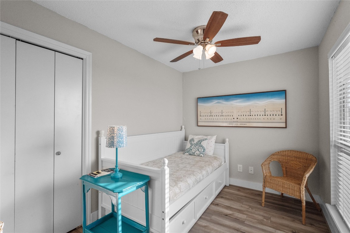 17729 Termini-San Luis Pass Road Galveston, TX 77554 - Photo 27 of 36 a living room with furniture and a chandelier