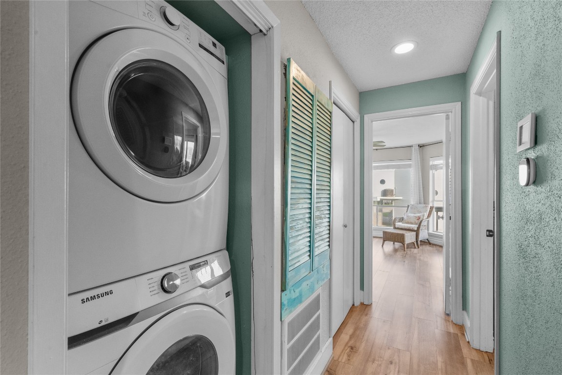 17729 Termini-San Luis Pass Road Galveston, TX 77554 - Photo 31 of 36 a view of a hallway with washer and dryer