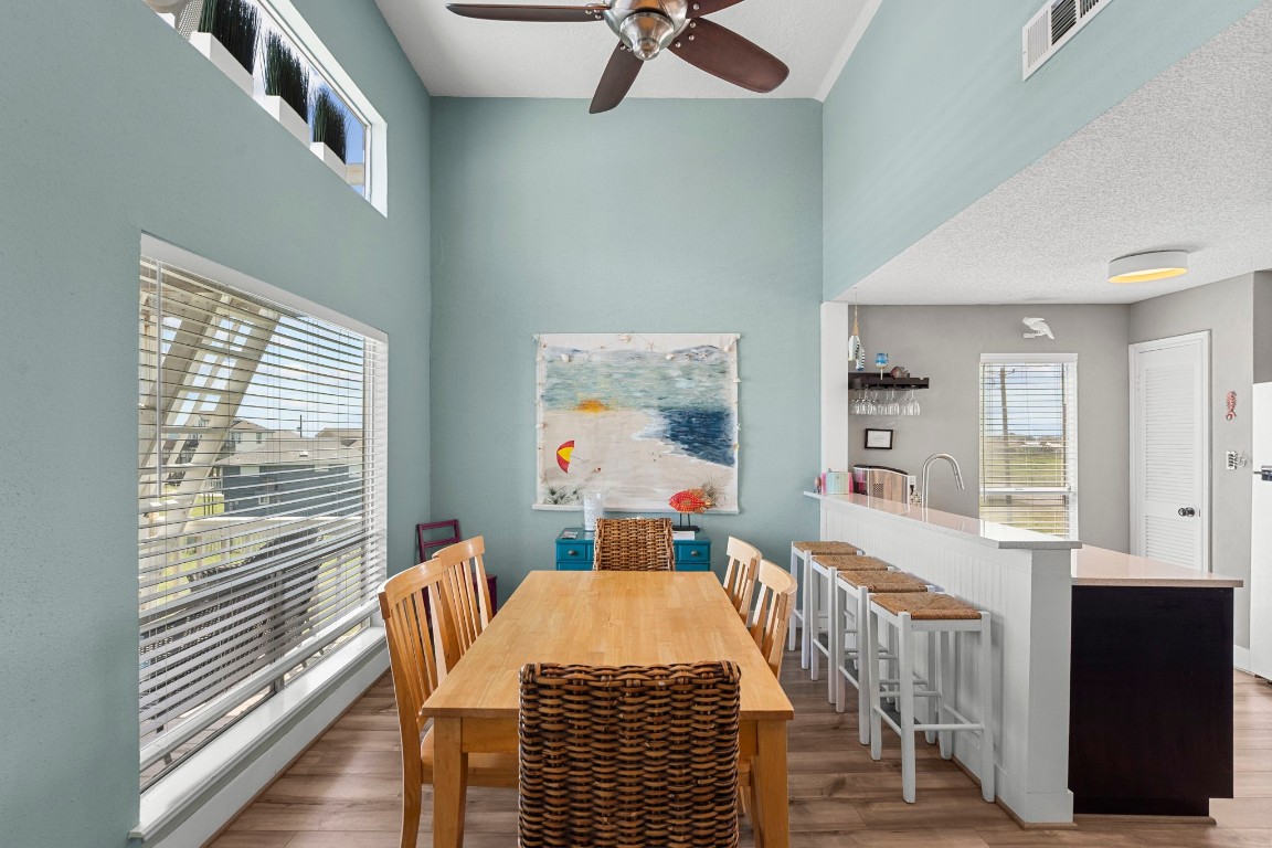 17729 Termini-San Luis Pass Road Galveston, TX 77554 - Photo 5 of 36 a view of a dining room with furniture window and wooden floor