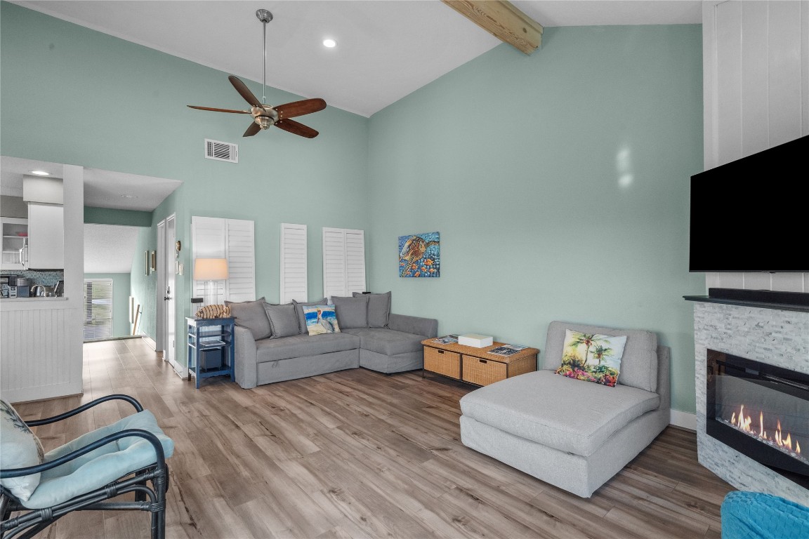 17729 Termini-San Luis Pass Road Galveston, TX 77554 - Photo 6 of 36 a living room with fireplace furniture and a flat screen tv