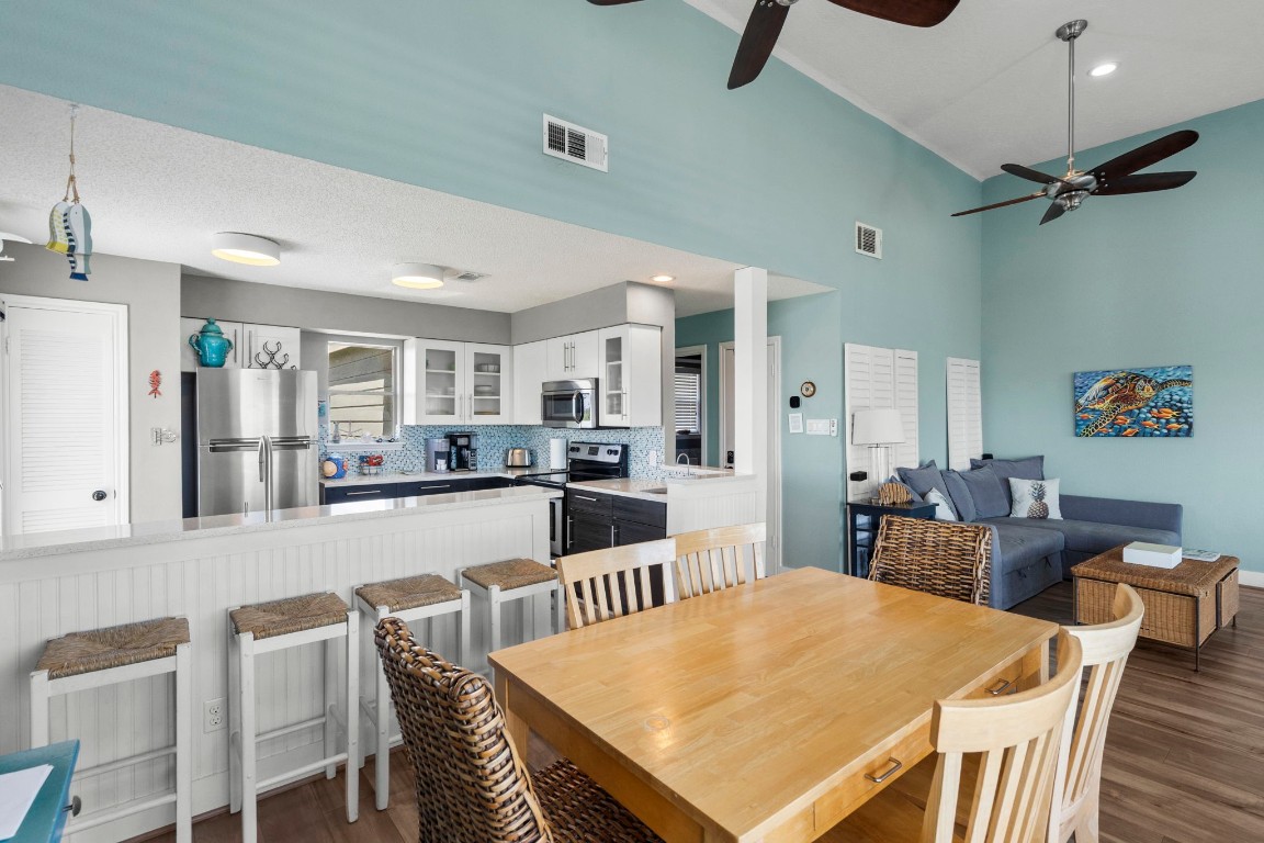17729 Termini-San Luis Pass Road Galveston, TX 77554 - Photo 8 of 36 a large kitchen with a table and chairs