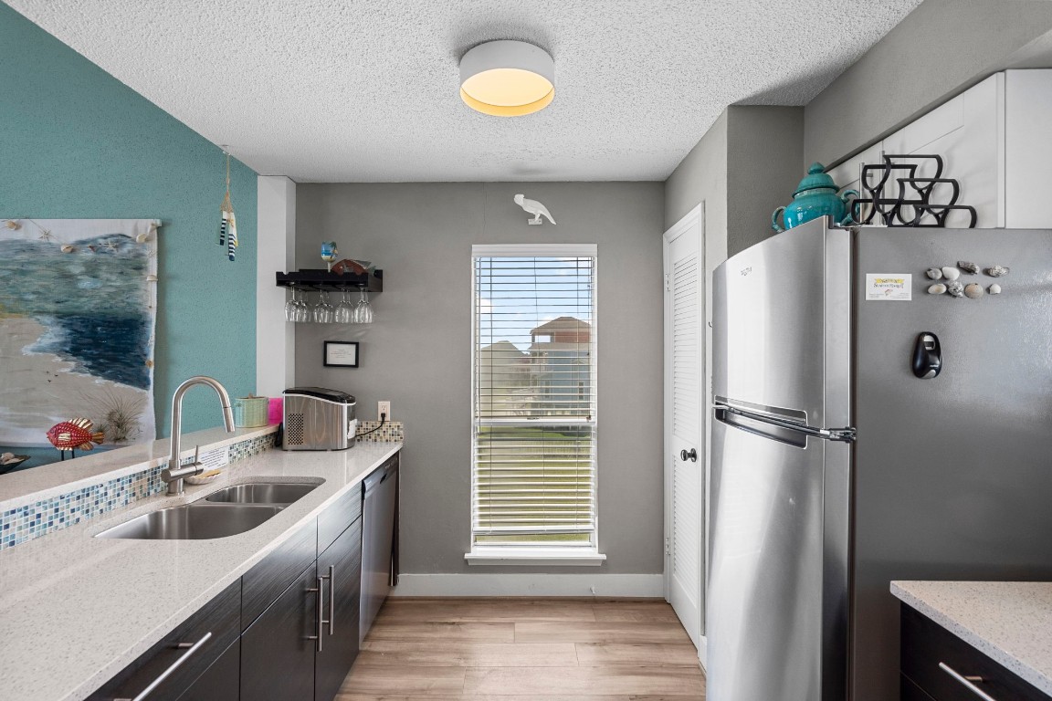 17729 Termini-San Luis Pass Road Galveston, TX 77554 - Photo 10 of 36 a kitchen with a sink appliances and cabinets