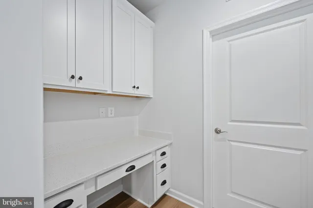 a bathroom with a granite countertop toilet a sink and a bathtub