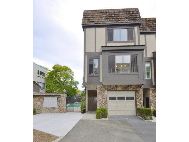a view of a house with a potted plant and a window
