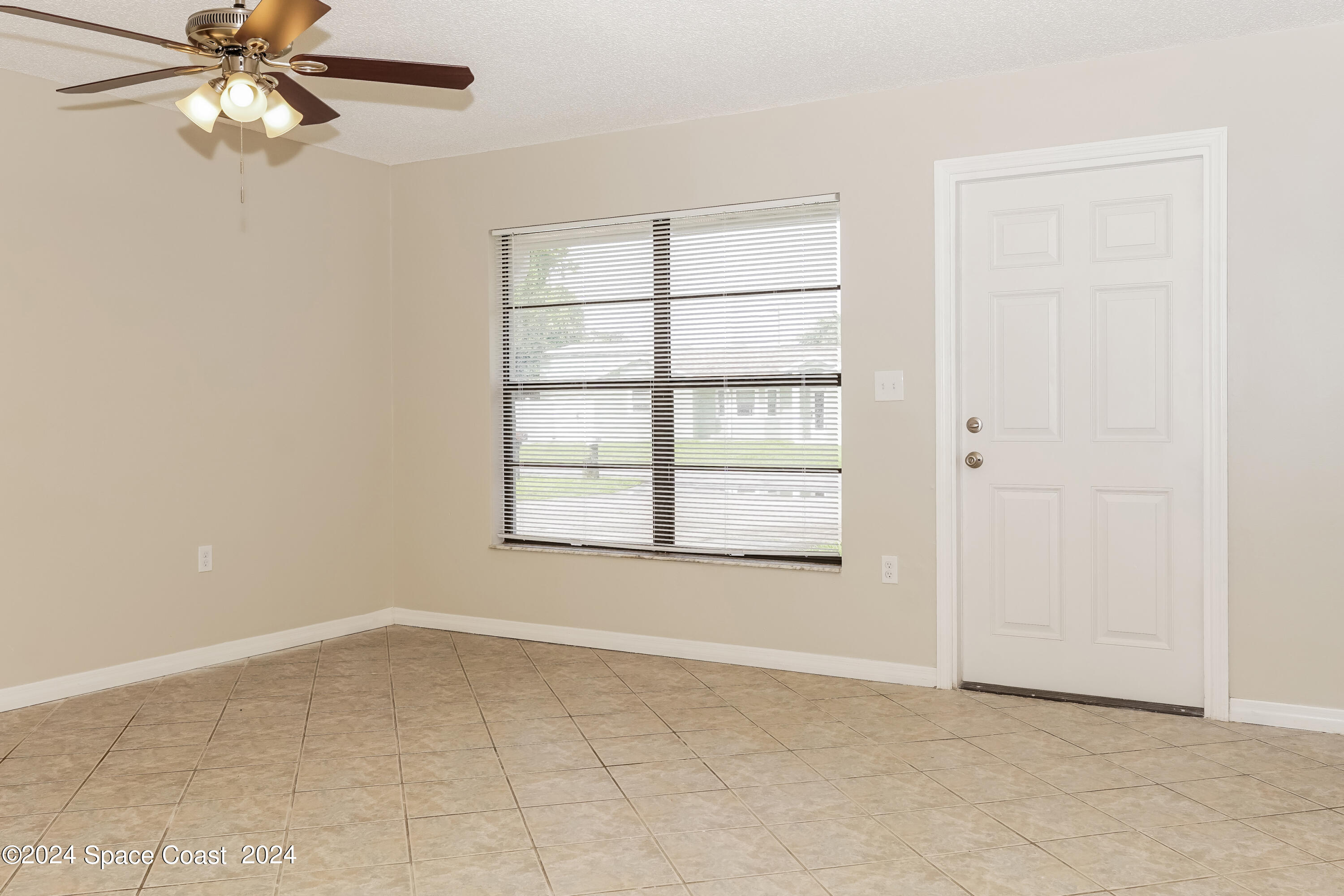 6830 Caliph Avenue Cocoa, FL 32927 - Photo 2 of 16 002-photo-living-room-11383783