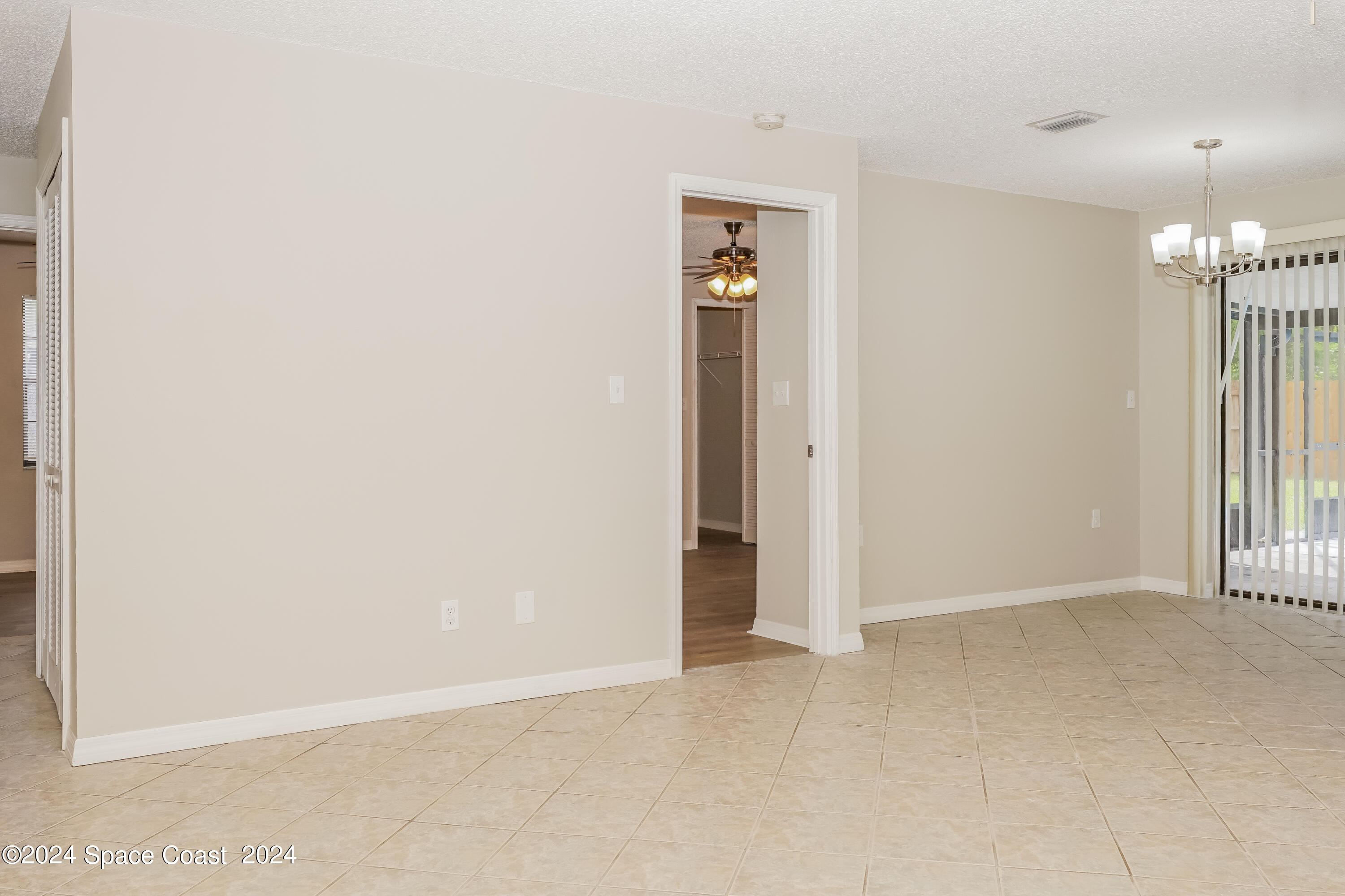 6830 Caliph Avenue Cocoa, FL 32927 - Photo 3 of 16 003-photo-living-room-11383784