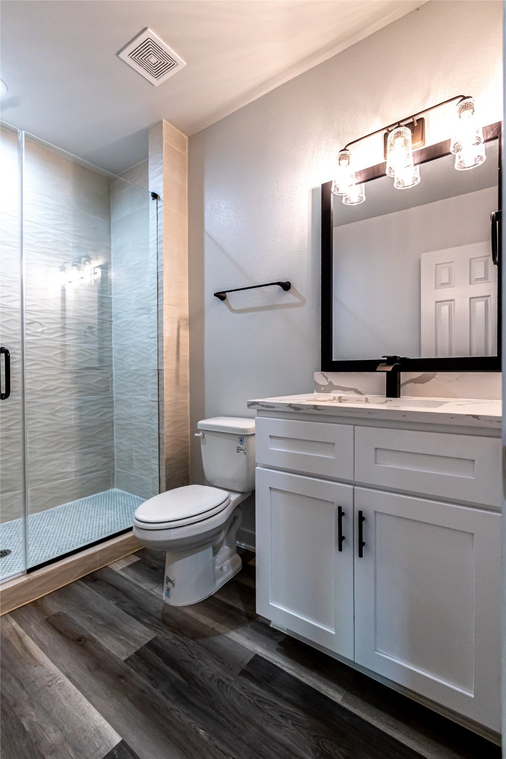102 Marsden Street, Unit 4 Houston, TX 77011 - Photo 11 of 26 a bathroom with a toilet a sink and shower