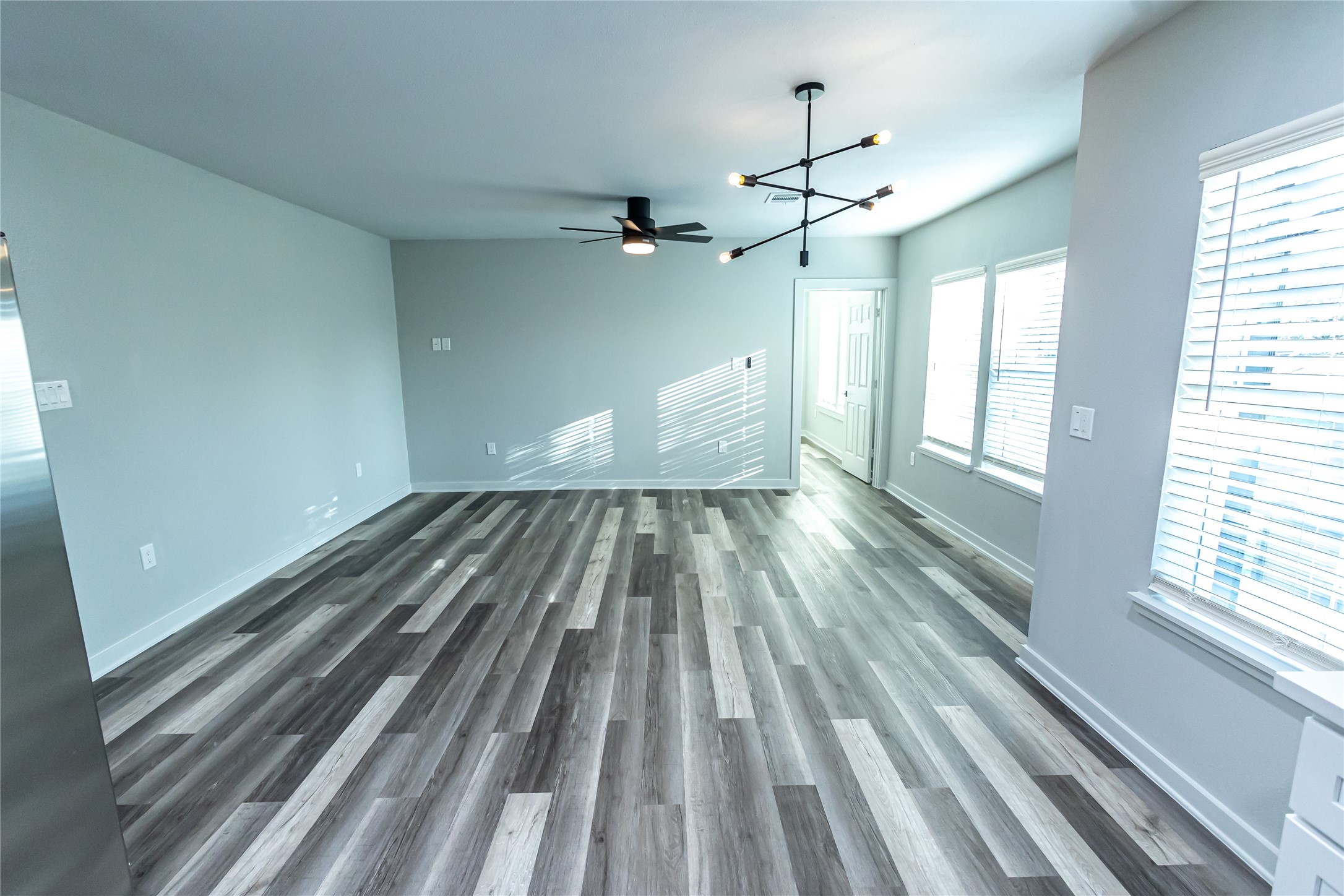 102 Marsden Street, Unit 4 Houston, TX 77011 - Photo 14 of 26 a view of empty room with wooden floor and fan