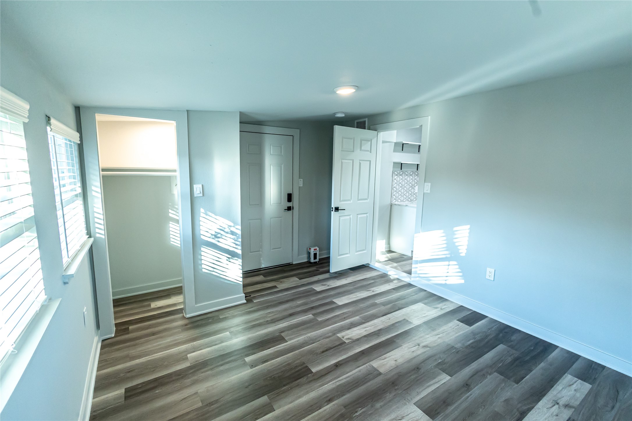 102 Marsden Street, Unit 4 Houston, TX 77011 - Photo 19 of 26 a view of a room with wooden floor and windows