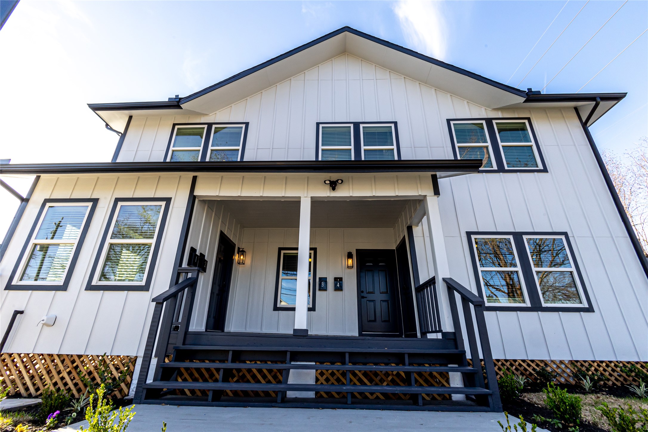 102 Marsden Street, Unit 4 Houston, TX 77011 - Photo 2 of 26 a view of a house with a small porch