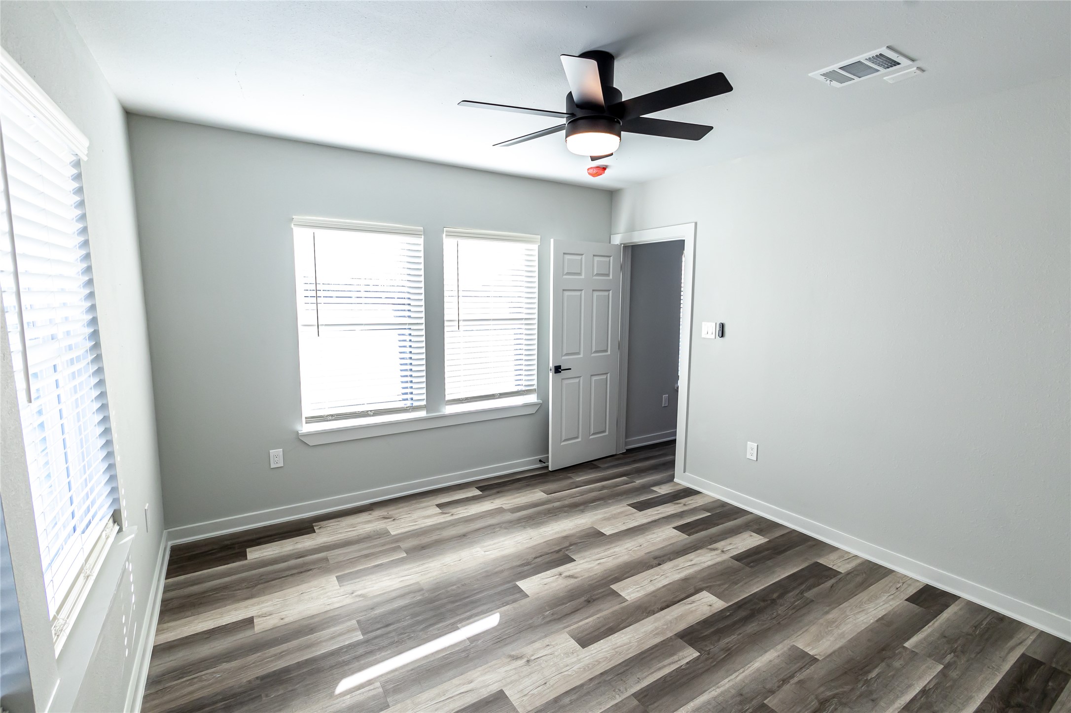 102 Marsden Street, Unit 4 Houston, TX 77011 - Photo 23 of 26 a view of room with window and ceiling fan