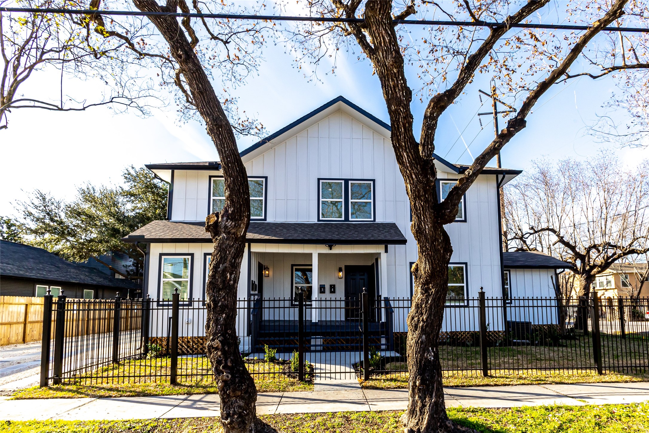 102 Marsden Street, Unit 4 Houston, TX 77011 - Photo 3 of 26 a front view of a house with garden
