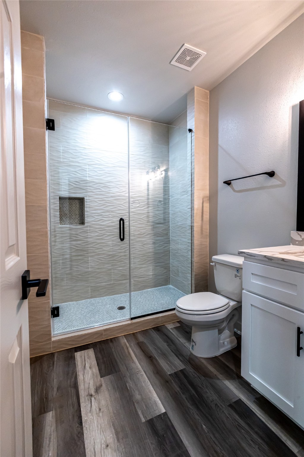 102 Marsden Street, Unit 4 Houston, TX 77011 - Photo 10 of 26 a bathroom with a toilet a sink and shower