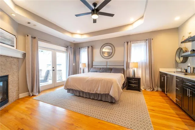 a spacious bathroom with a granite countertop tub sink and mirror