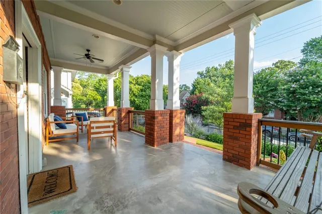 a view of a porch with chairs and backyard