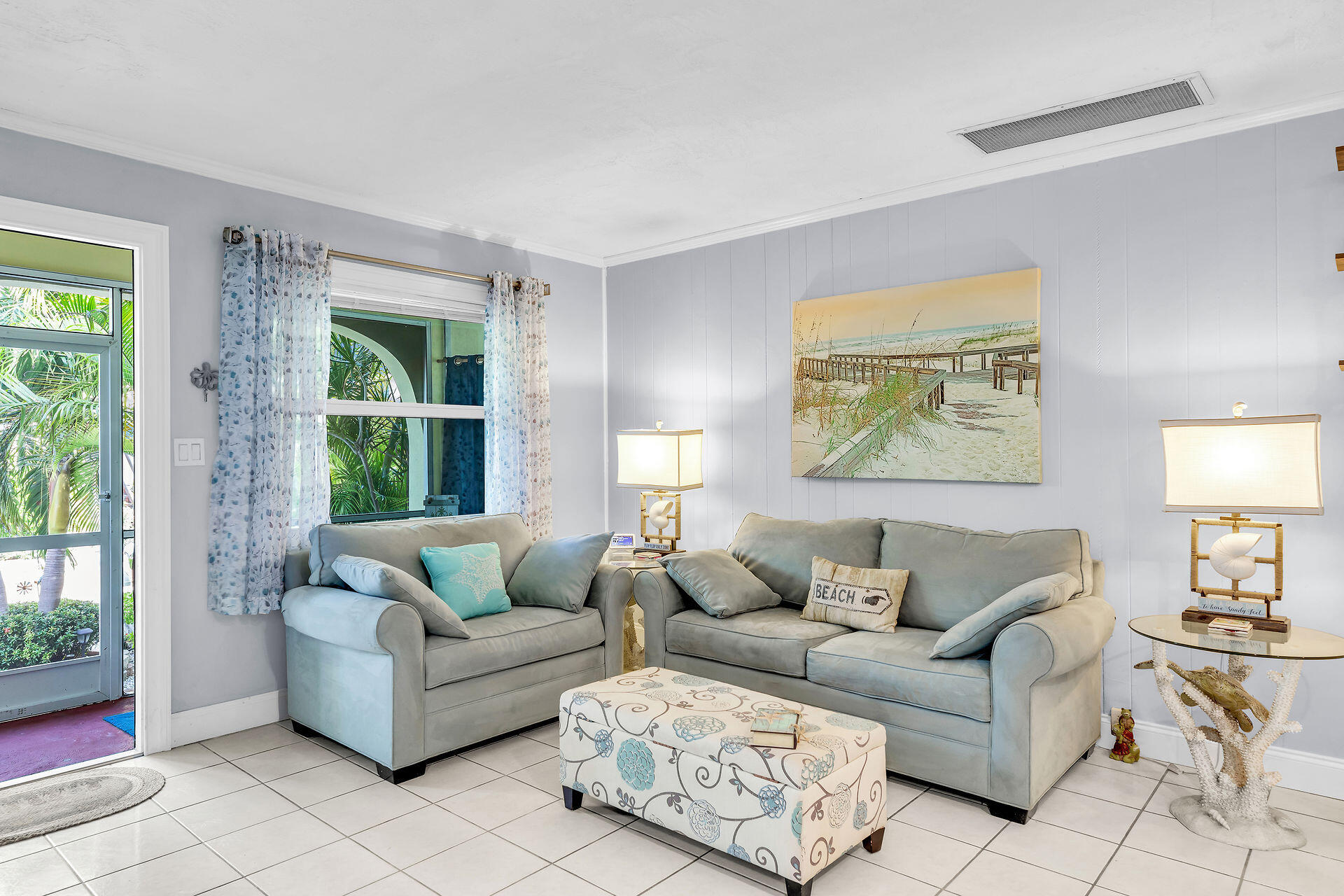 211 120 St Gulf, Unit B Marathon, FL 33050 - Photo 14 of 33 a living room with furniture and a large window