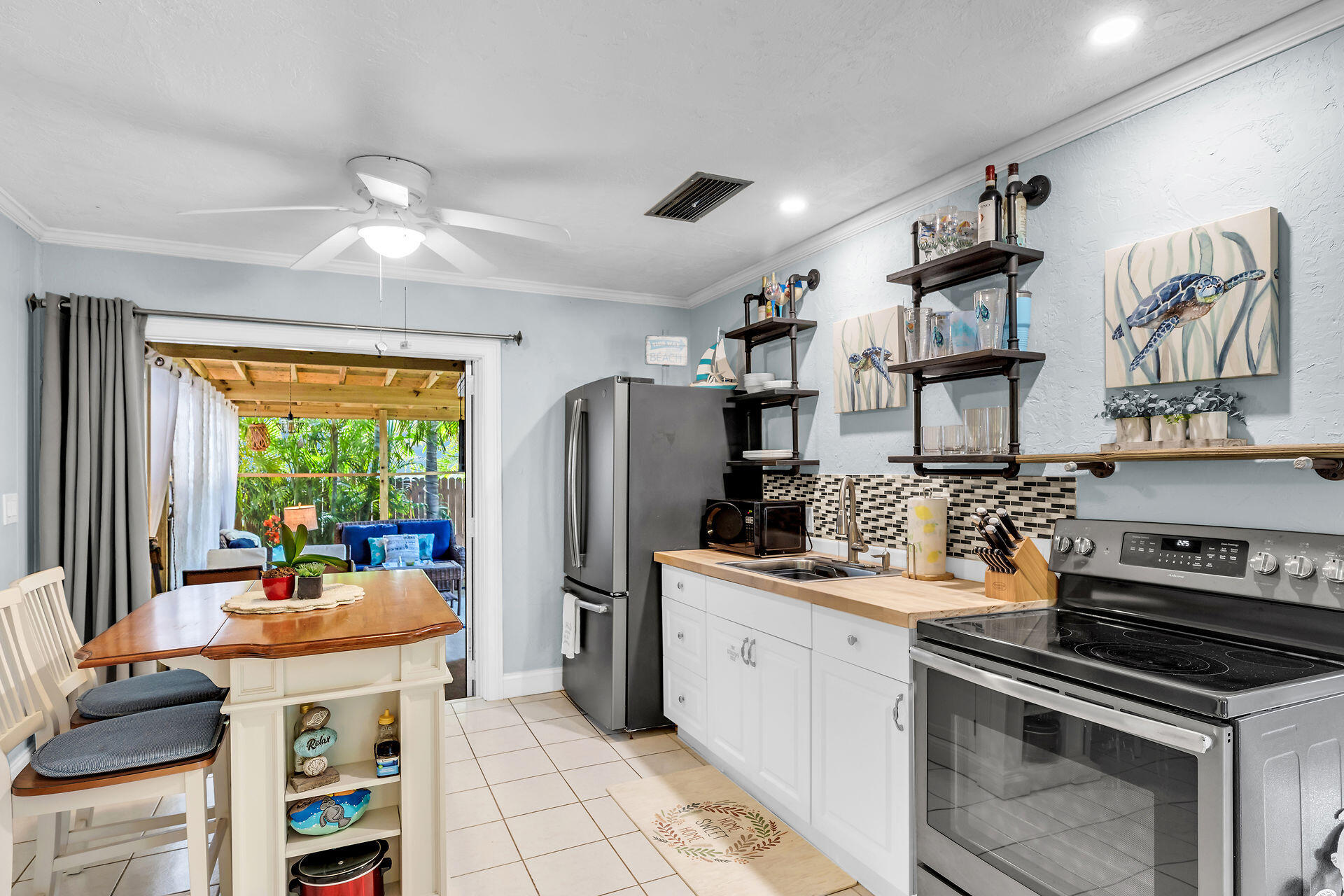 211 120 St Gulf, Unit B Marathon, FL 33050 - Photo 16 of 33 a kitchen with stainless steel appliances a stove a refrigerator and a sink