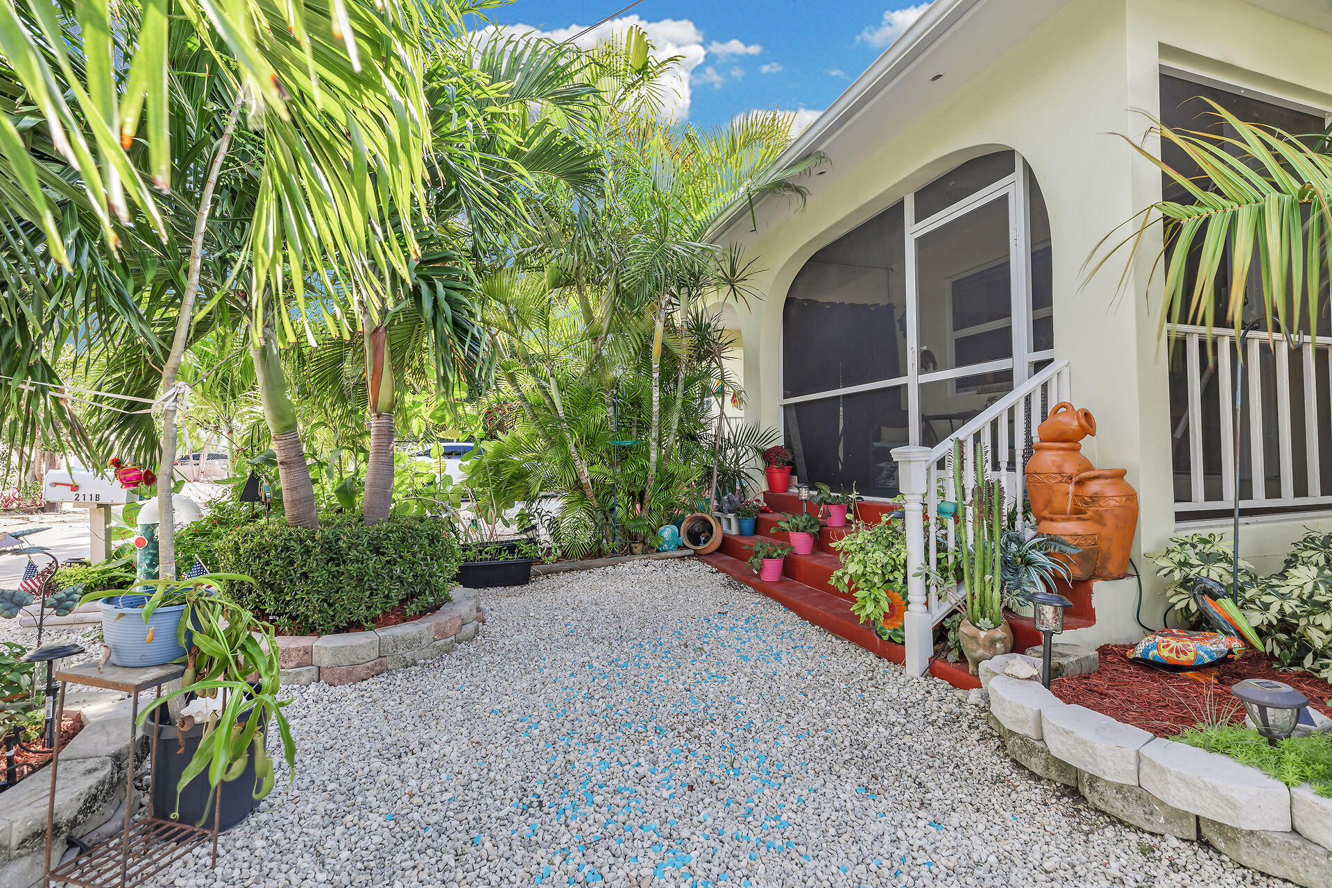 211 120 St Gulf, Unit B Marathon, FL 33050 - Photo 2 of 33 a backyard of a house with lots of green space