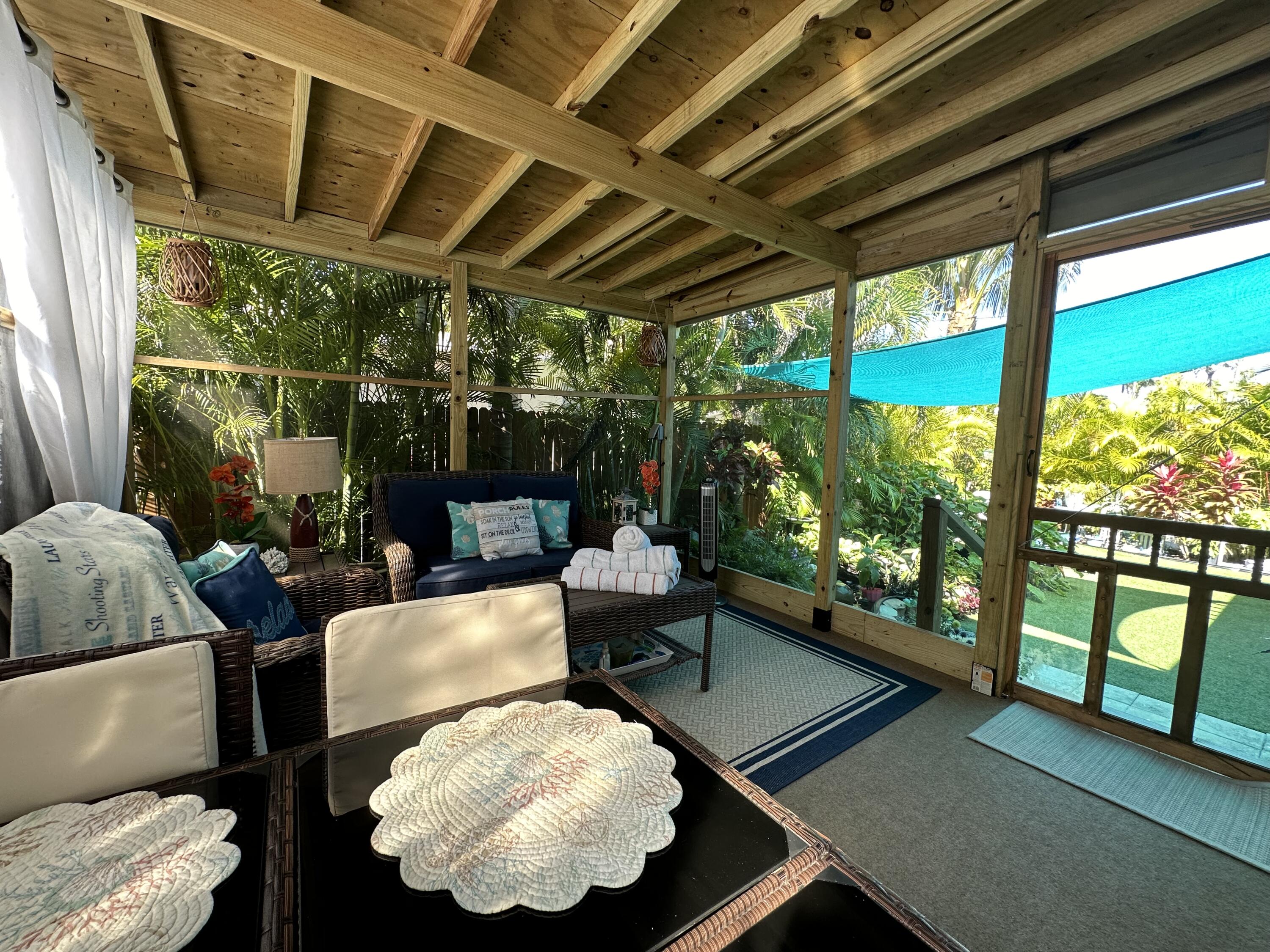 211 120 St Gulf, Unit B Marathon, FL 33050 - Photo 25 of 33 a living room with furniture and a large window