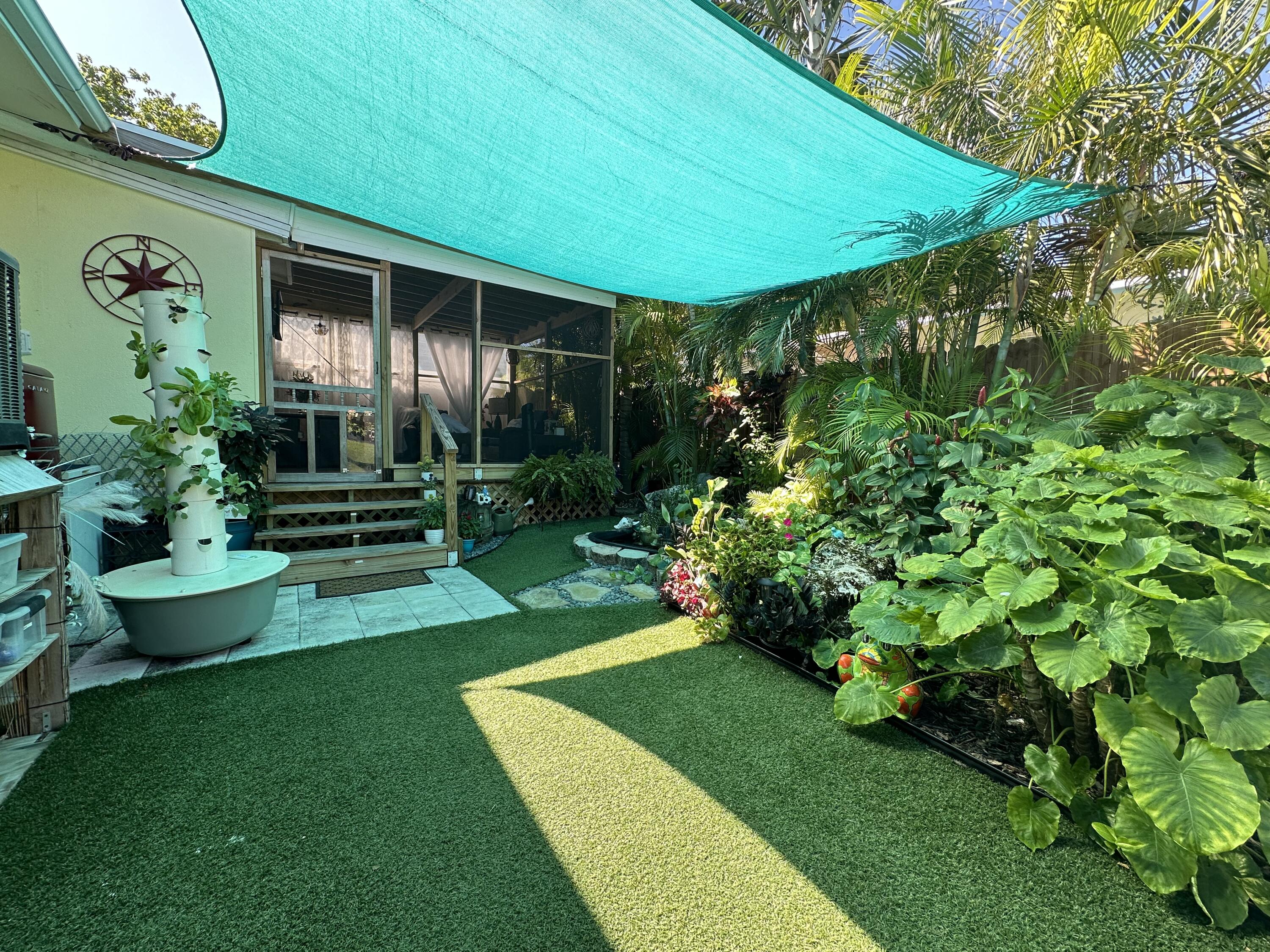 211 120 St Gulf, Unit B Marathon, FL 33050 - Photo 6 of 33 a view of a house with backyard sitting area and garden